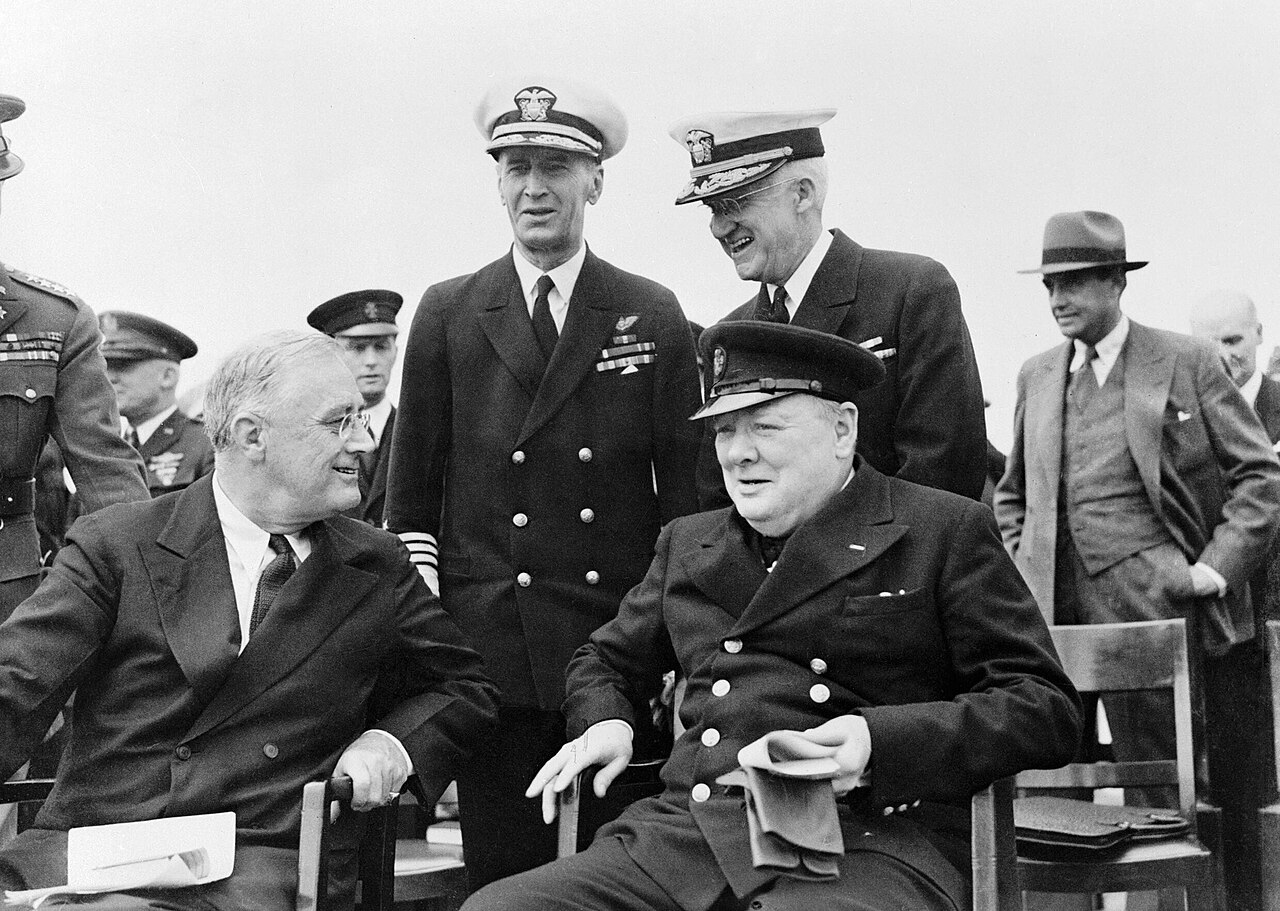 Franklin D. Roosevelt and Winston Churchill seated together during the Atlantic Conference in August 1941