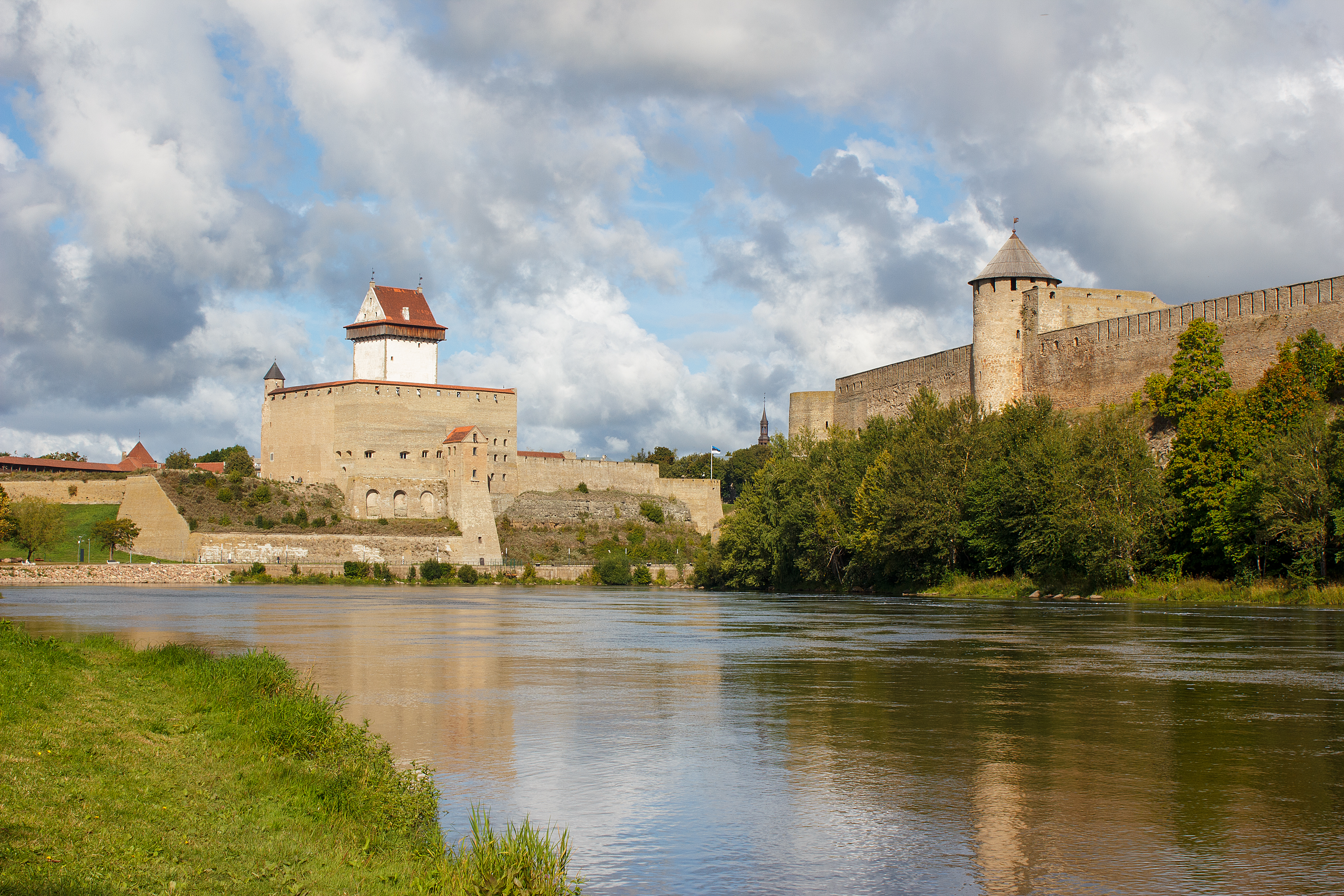 Narva Castle in Estonia and Ivangorod Fortress in Russia face each other across the Narva River along the Estonia-Russia border, 2023.