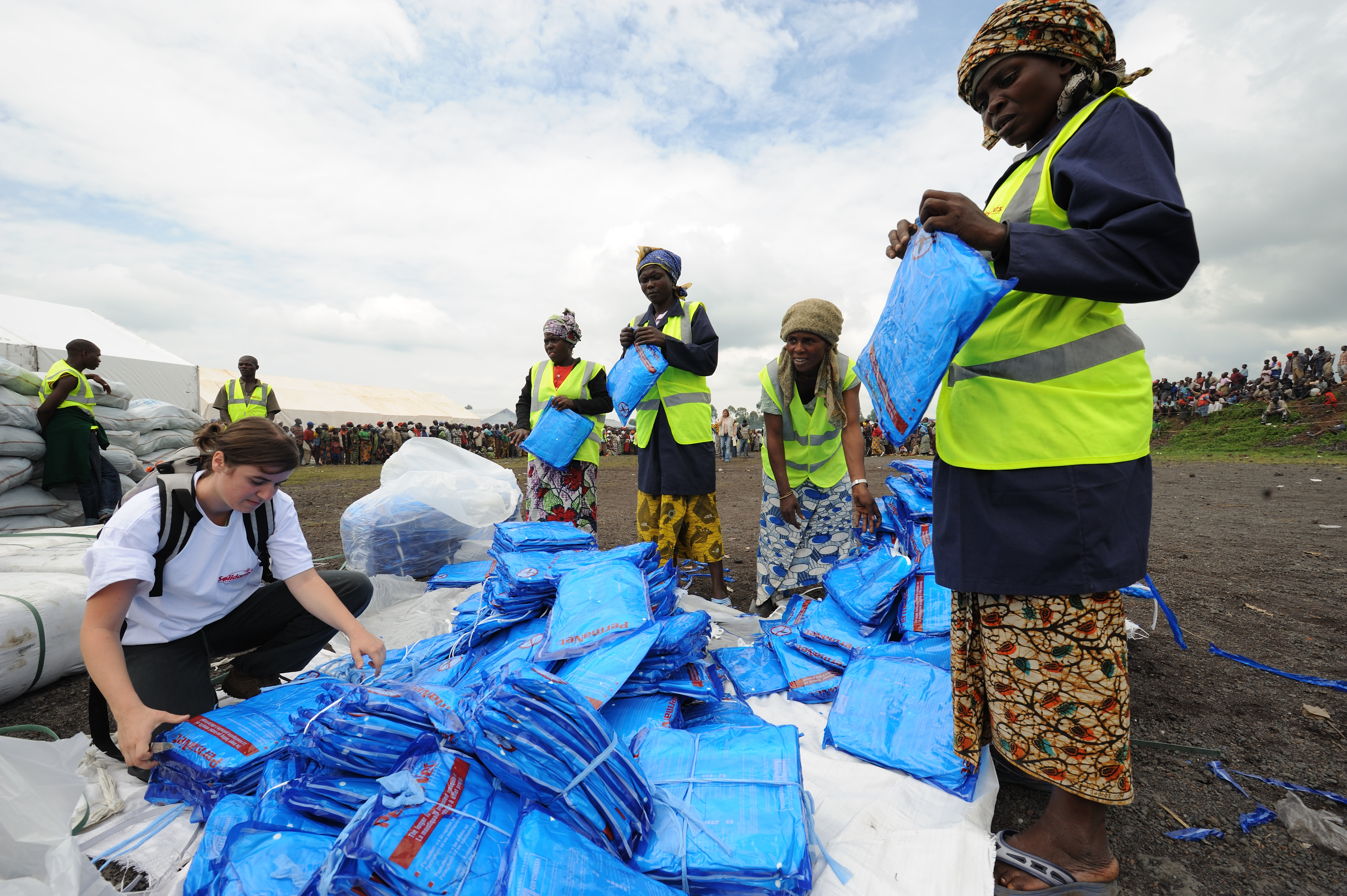 Mosquito nets are distributed as part of an aid package at Kibati camp in the Democratic Republic of the Congo.