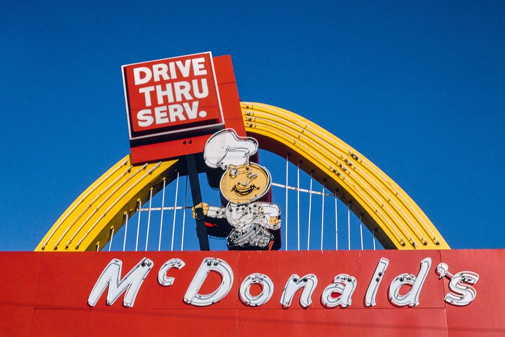 A vintage McDonald’s drive-thru sign displays the brand’s distinctive red and yellow colour scheme.