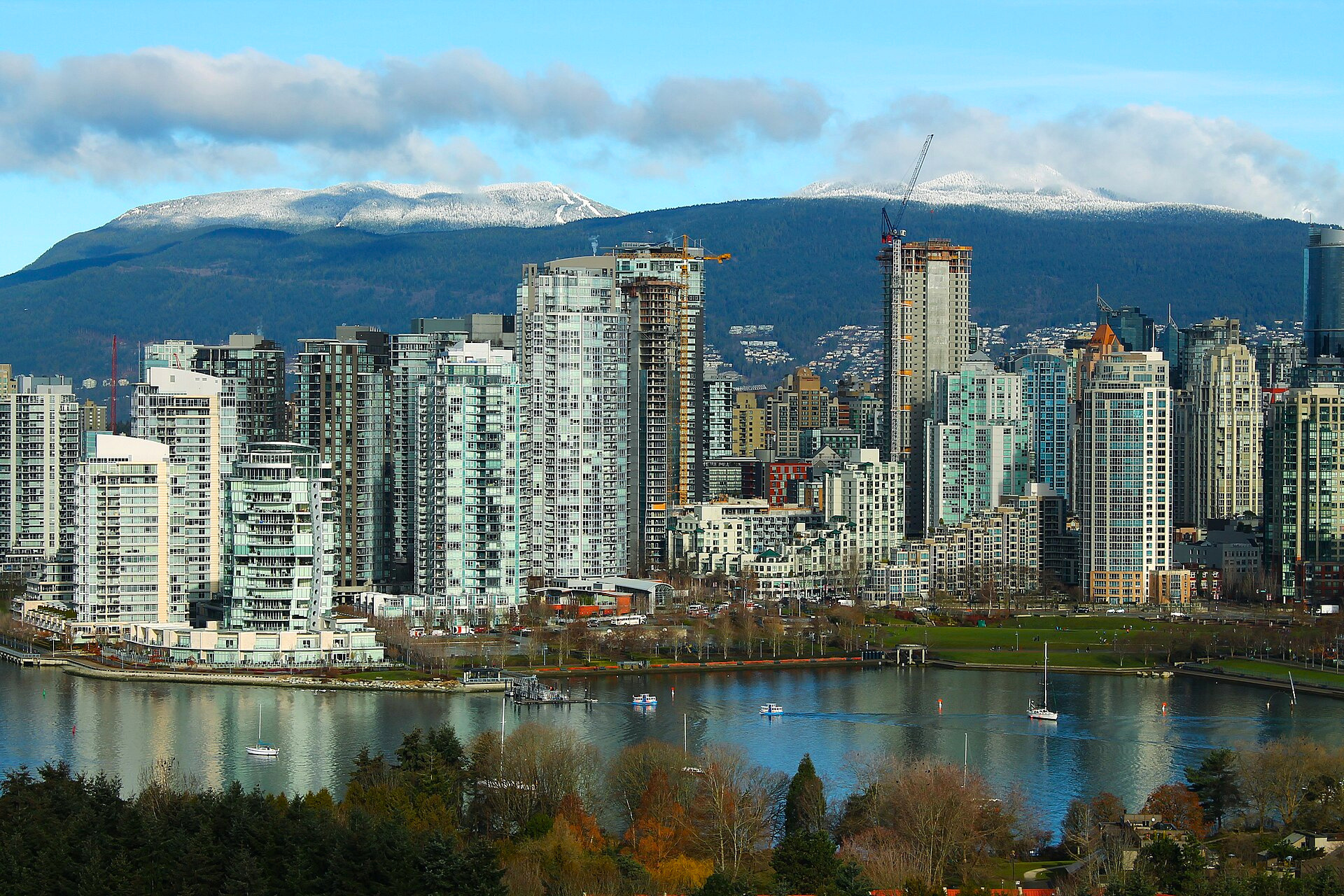 Condominium towers line False Creek in Vancouver, Canada.